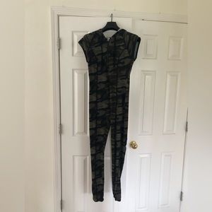 Never worn, super cute camouflage stretchy jumpsuit with zipper and hood.